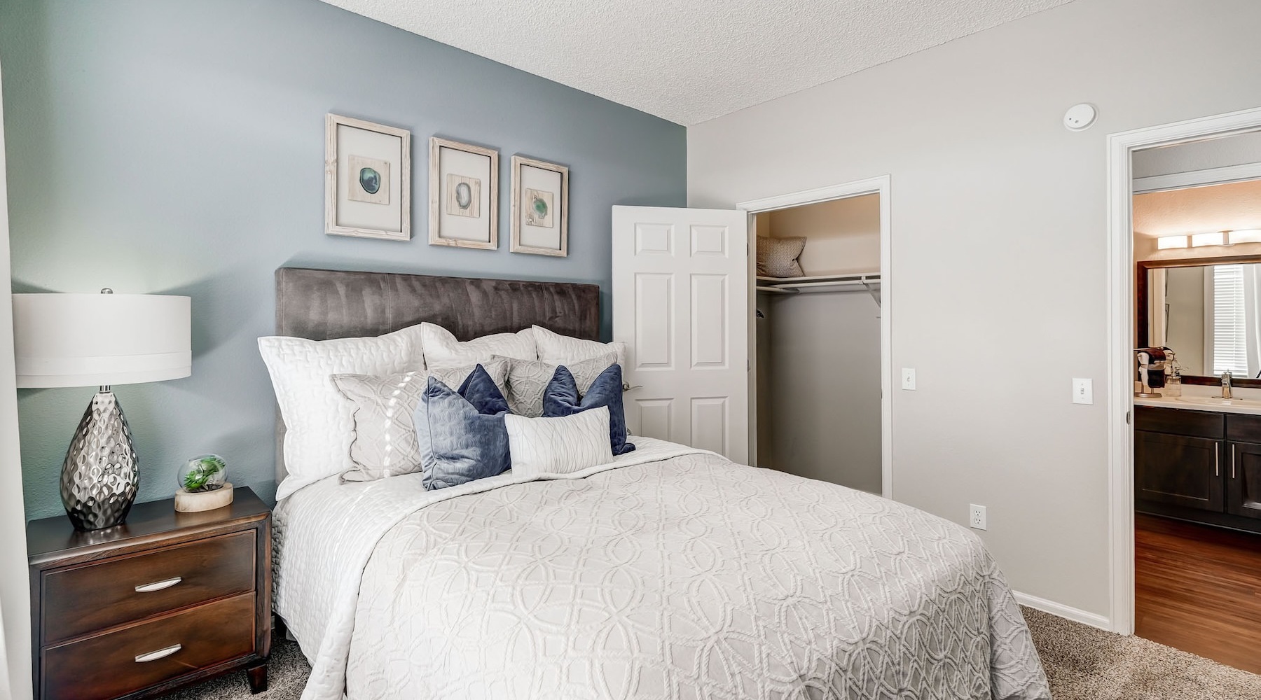 a bedroom with a bed and a dresser