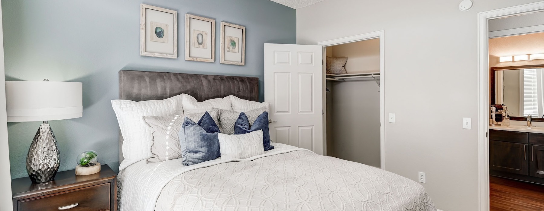 a bedroom with a bed and a dresser