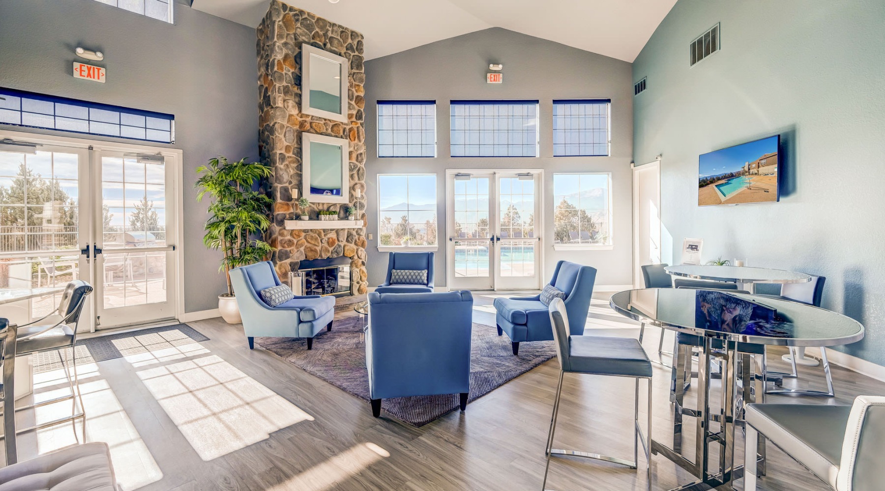 a clubroom with tables and chairs