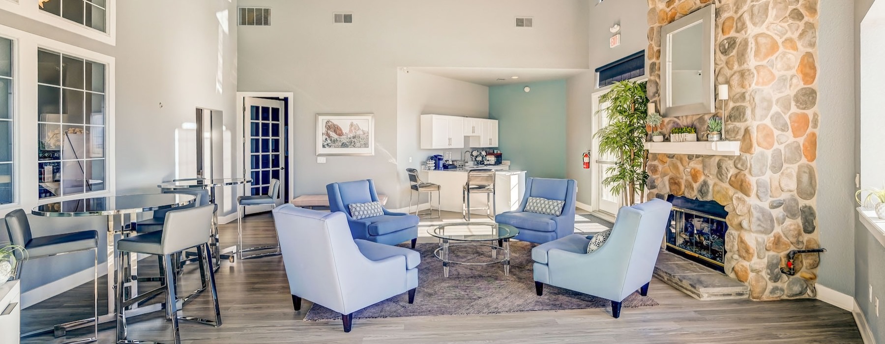 a clubroom with tables and chairs
