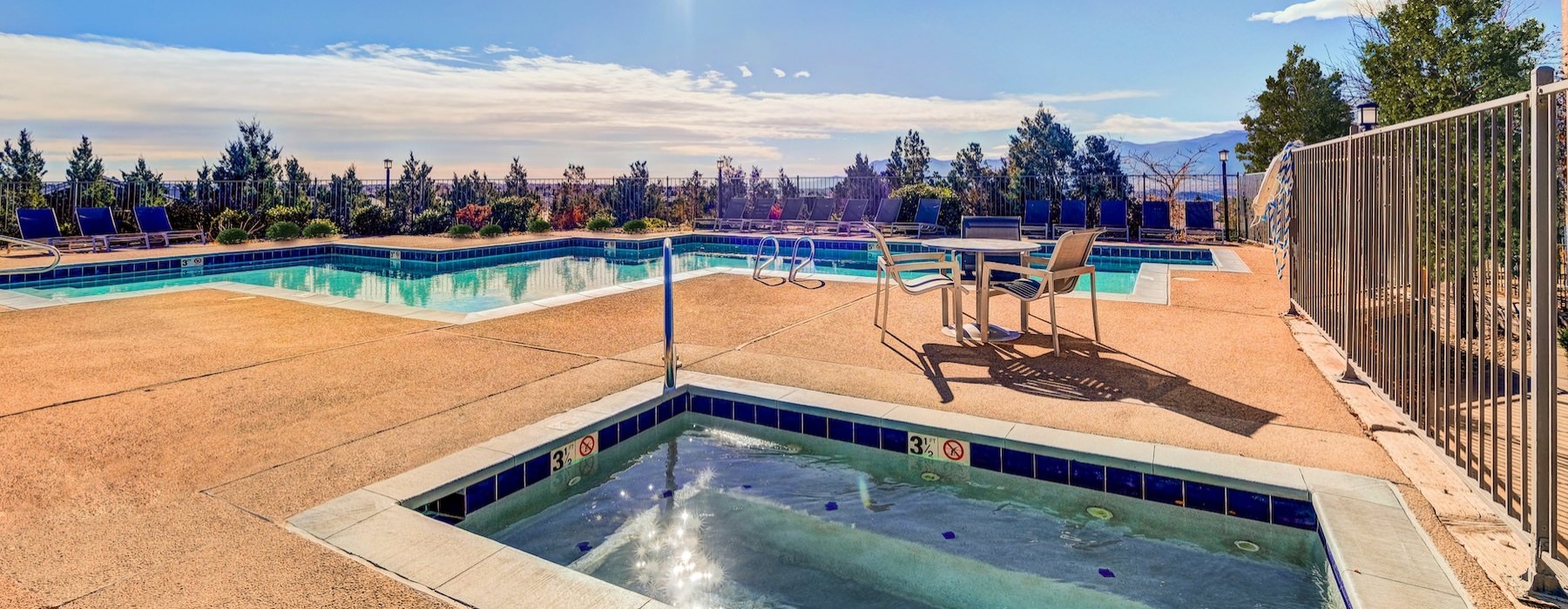 a swimming pool with a fence around it