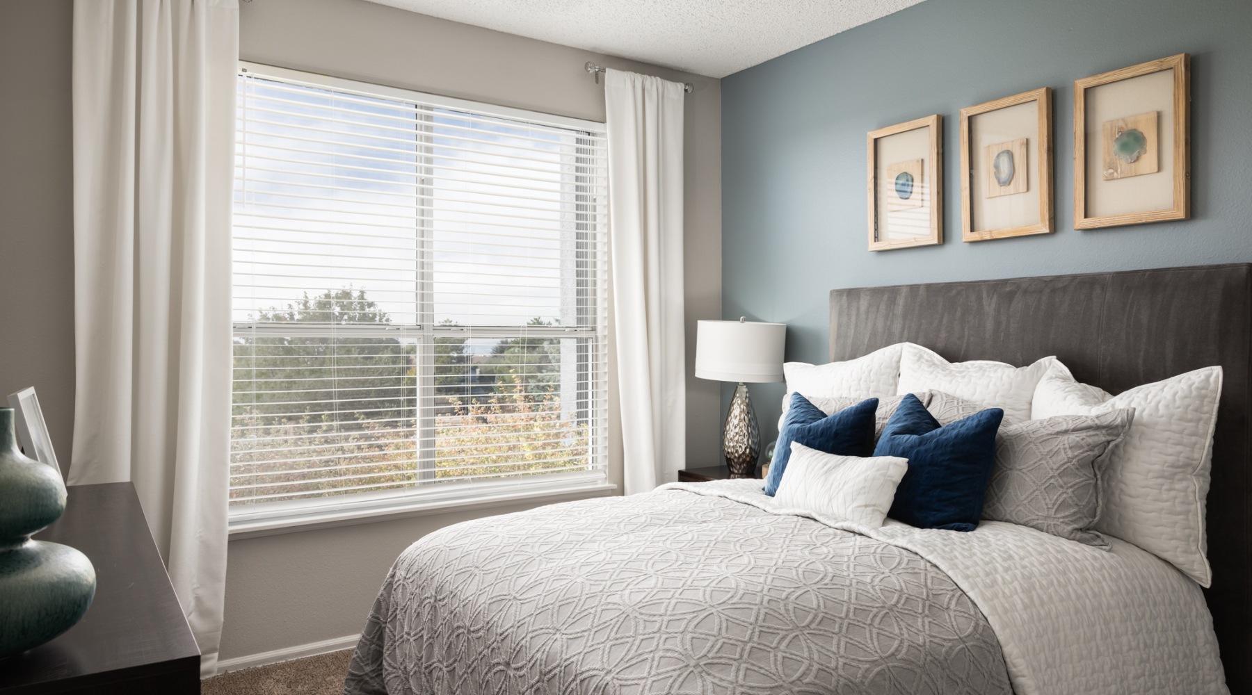 a bedroom with a bed and a dresser