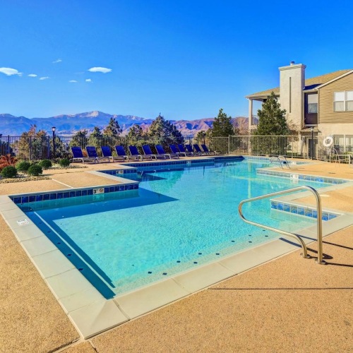 a swimming pool next to a building